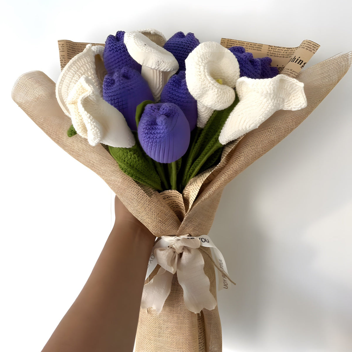 Purple crochet tulips and white calla lilies wrapped in jute