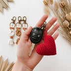 Crochet red heart keychain lifestyle shot, handmade in Toronto