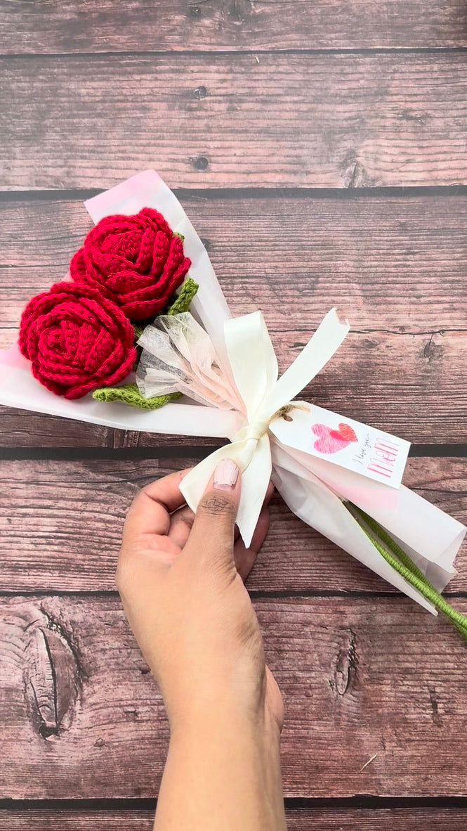 Pair of crochet red roses viewed from below, handmade bouquet from Toronto