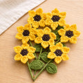 Crochet sunflower fridge magnet flatlay, handmade in Toronto by Looped Little Things