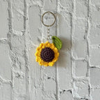 Crochet sunflower keychain product shot, handmade by Looped Little Things