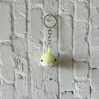 Crochet whale keychain product shot, handmade bag charm by Looped Little Things