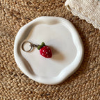 Crochet strawberry keychain, handmade amigurumi bag charm by Looped Little Things